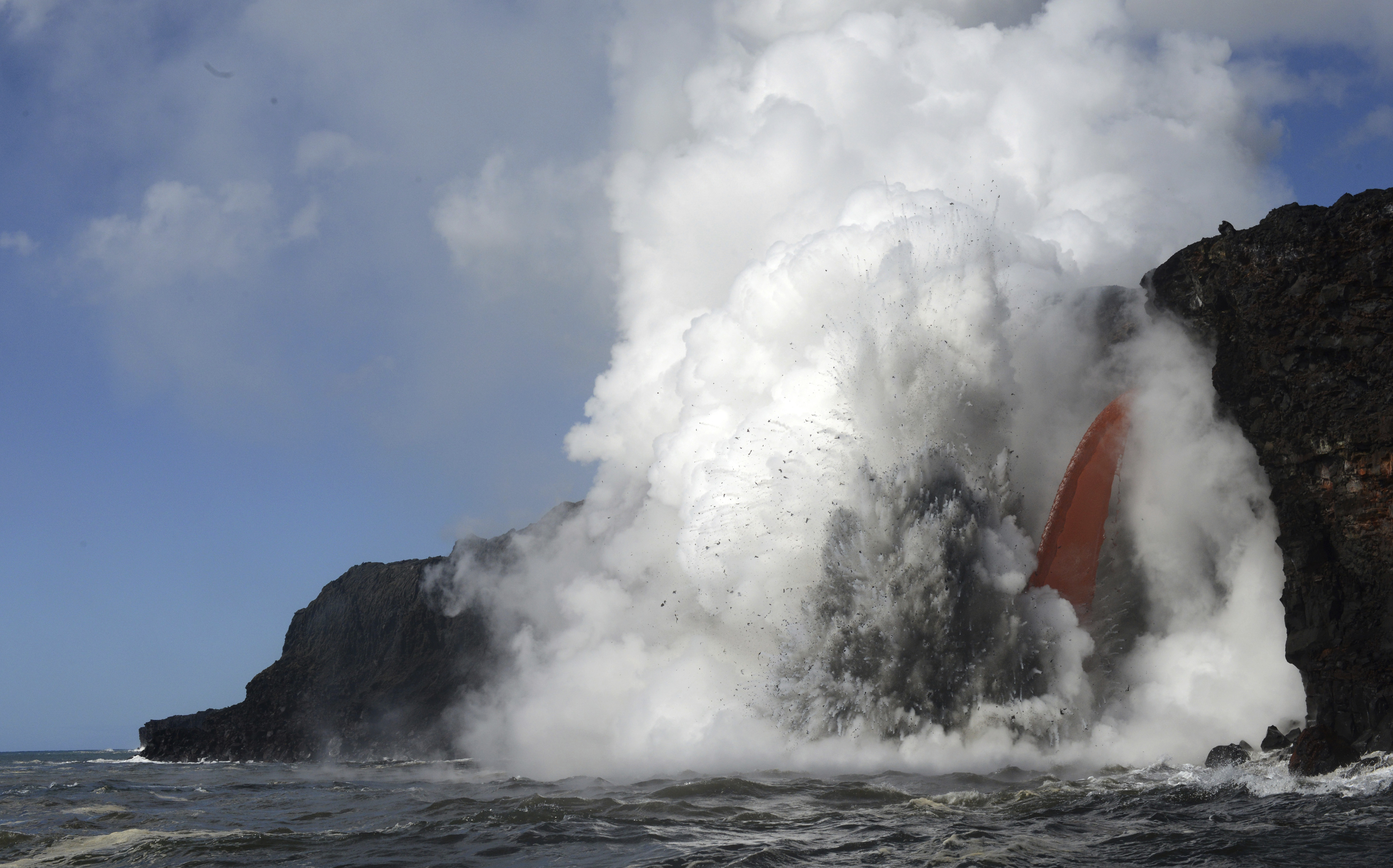 Massive lava stream exploding into ocean in Hawaii