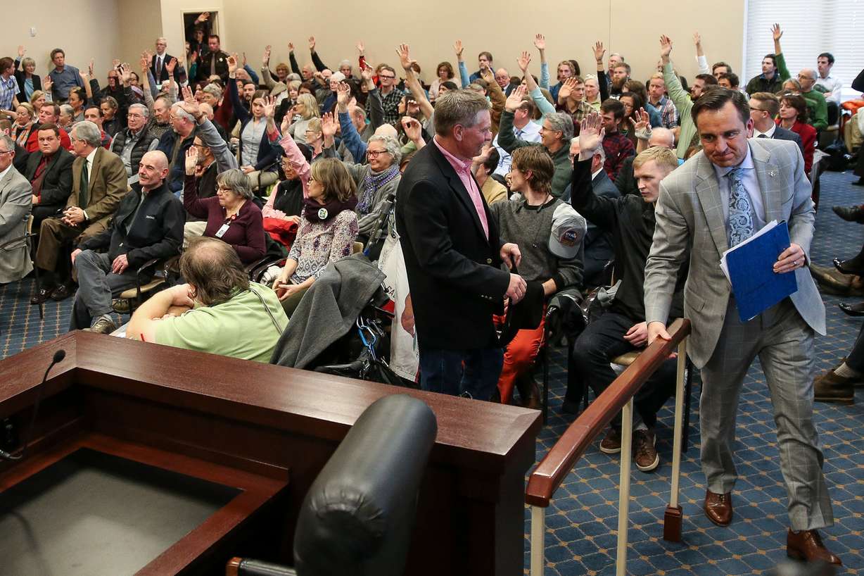House Speaker Greg Hughes, R-Draper, right, moves to take a seat as members of the public raise their hands to indicate they oppose HCR11, a resolution urging the president to rescind the Bears Ears National Monument designation, during a Senate Natural Resources, Agriculture and Environment Committee hearing at the Capitol in Salt Lake City on Thursday, Feb. 2, 2017. (Photo: Spenser Heaps, Deseret News)