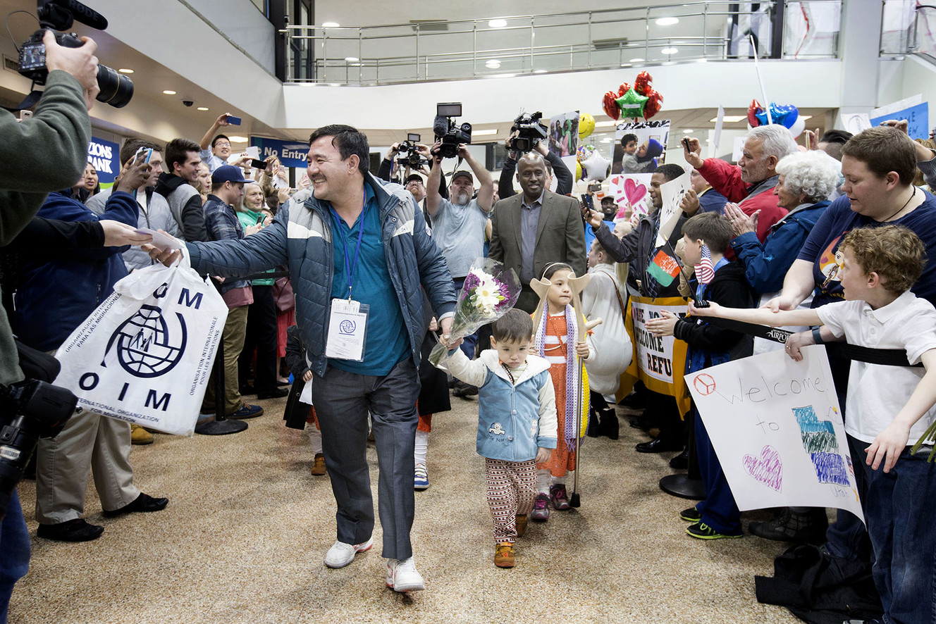 Hassan Ali Hassan holds the hand of his son, Ghulam Hassan, as they are welcomed to Salt Lake City by hundreds of people at the Salt Lake City International Airport on Thursday, Feb. 2, 2017. The family, originally from Afghanistan, was brought to Utah with the assistance of Catholic Community Services of Utah before President Donald Trump's 120-day ban on refugee arrivals could take effect. (Photo: Laura Seitz, Deseret News)