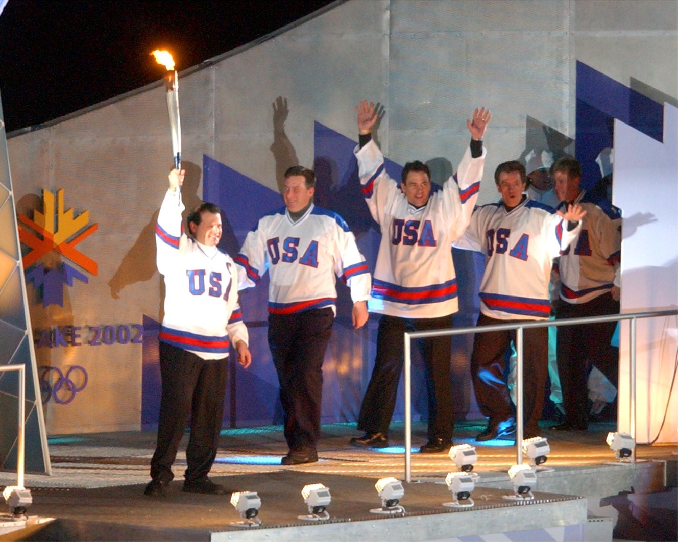 The 1980 USA Hockey team lights the cauldron during the Salt Lake 2002 Olympic Winter Games Opening Ceremony at Rice-Eccles Stadium, Friday, Feb 8, 2002. (Photo: Johanna Workman, Deseret News, File)