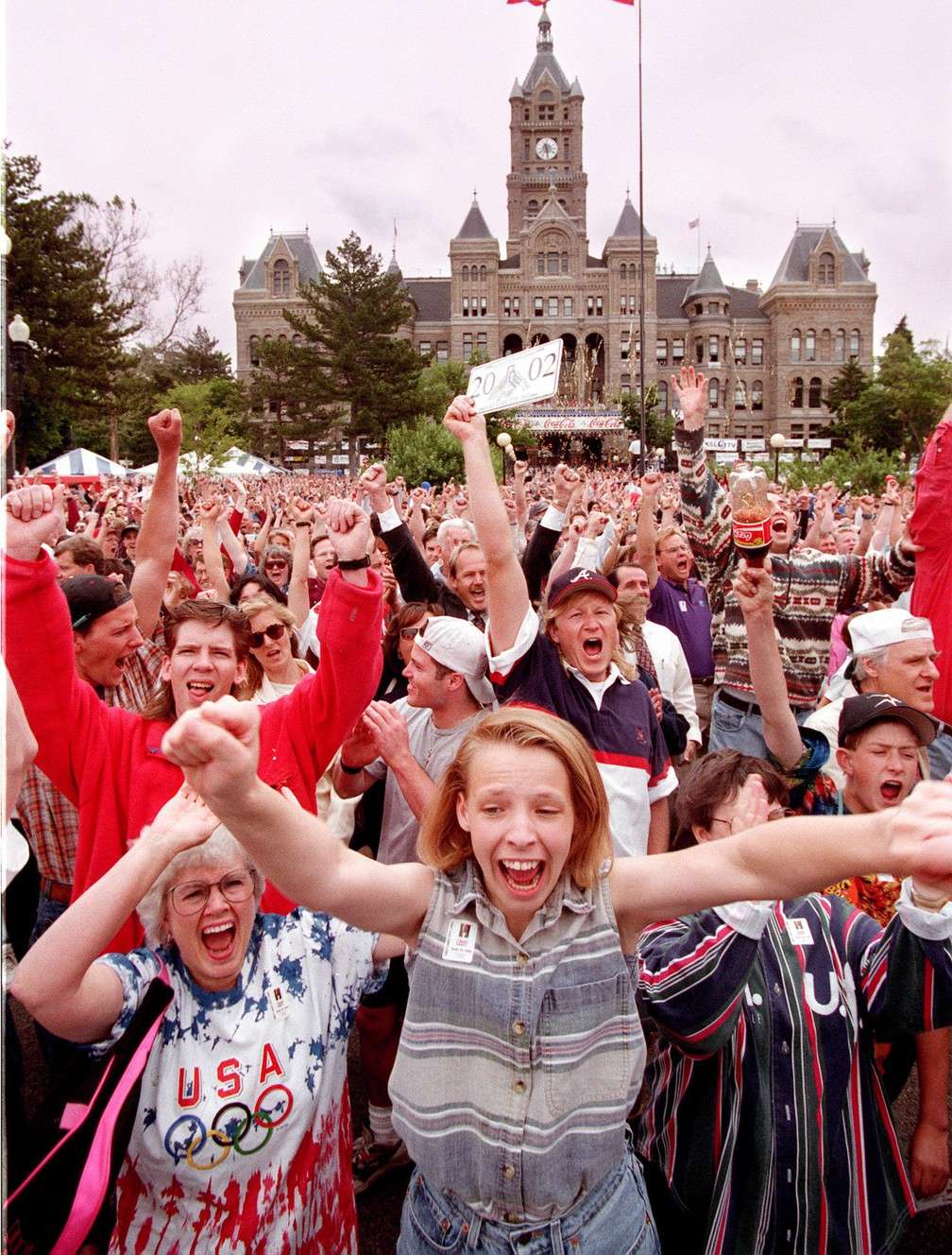 Joan Berg, left, and Kellie Bowen both of Sandy, and thousands of party revelers at the Salt lake City County Building jump for joy as the announcement of Salt Lake City being awarded the 2002 Olympics on June 16, 1995. (Photo: Ravell Call, Deseret News, File)
