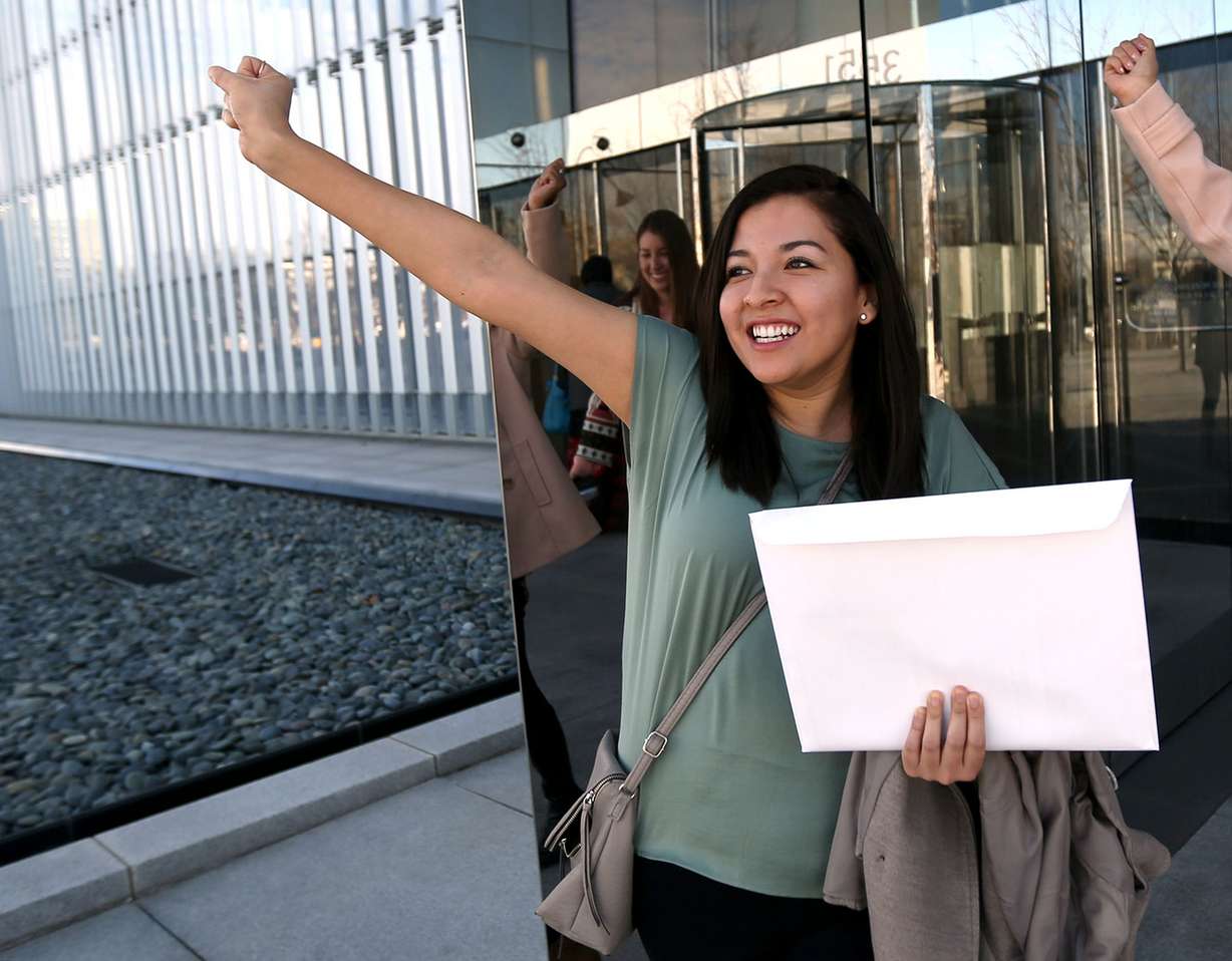 Katherine Portocarrero, from Peru, celebrates after becoming an American citizen during a naturalization ceremony at the federal courthouse in Salt Lake City on Wednesday, Feb. 8, 2017. Her sister, Pamela Portocarrero, who does not have legal status in the United States, worries she could face deportation if the Trump administration strikes the Deferred Action for Childhood Arrivals program. (Photo: Kristin Murphy, Deseret News)