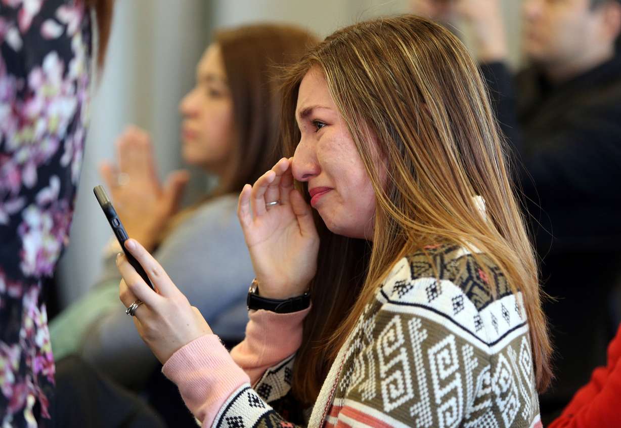 Pamela Portocarrero, from Peru, gets emotional as she watches her mother, Elizabeth Newberry, and sister, Katherine Portocarrero, become American citizens during a naturalization ceremony at the federal courthouse in Salt Lake City on Wednesday, Feb. 8, 2017. Pamela Portocarrero, who does not have legal status in the United States, worries she could face deportation if the Trump administration strikes the Deferred Action for Childhood Arrivals program. (Photo: Kristin Murphy, Deseret News)