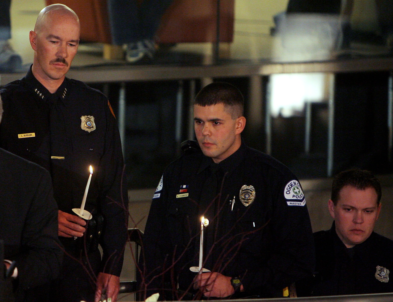 Salt Lake City Police Chief Chris Burbank (left) stands with Ogden Police officer Ken Hammond and others involved in the shooting as Members of the Community, Police officers and family of those who lost their lives attend a Ceremony at the Salt Lake City Library to remember. (Photo: Scott G. Winterton, Deseret News, File)