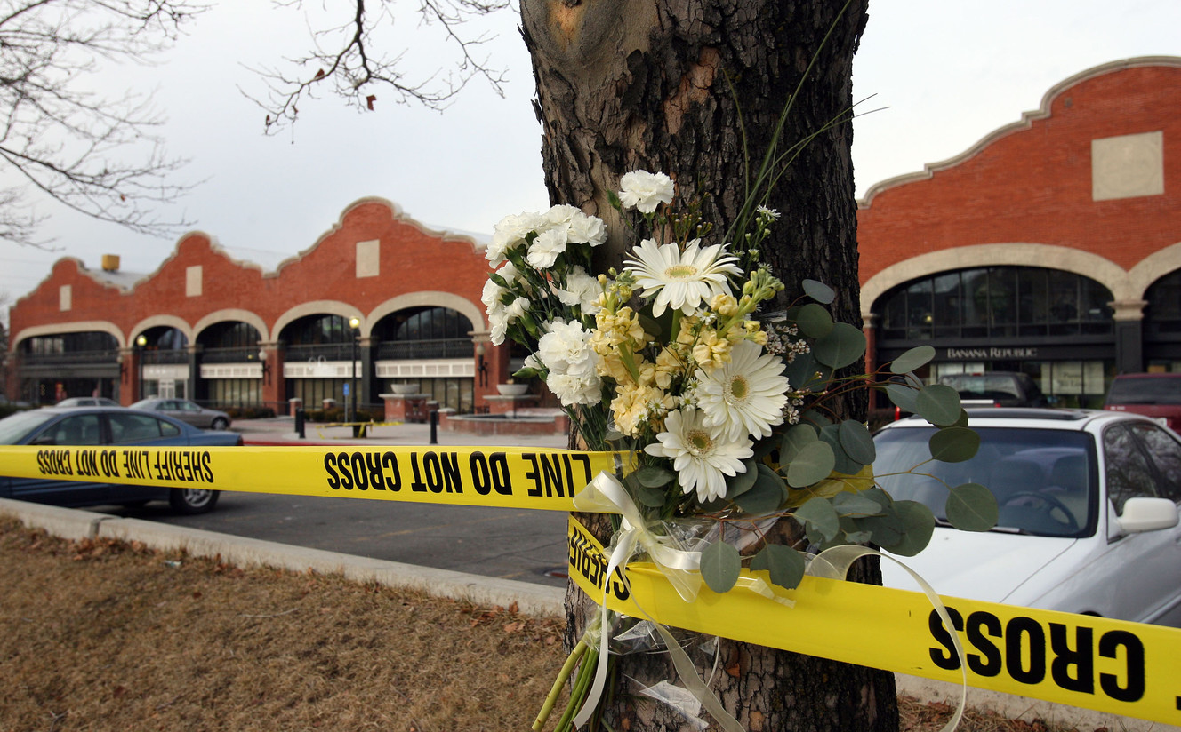 Flowers were left in the police tape at Trolley Square in Salt Lake City Feb 13, 2007 after gunman killed five people. Police killed the gunman. (Photo: Jeffrey D. Allred, Deseret News, File)