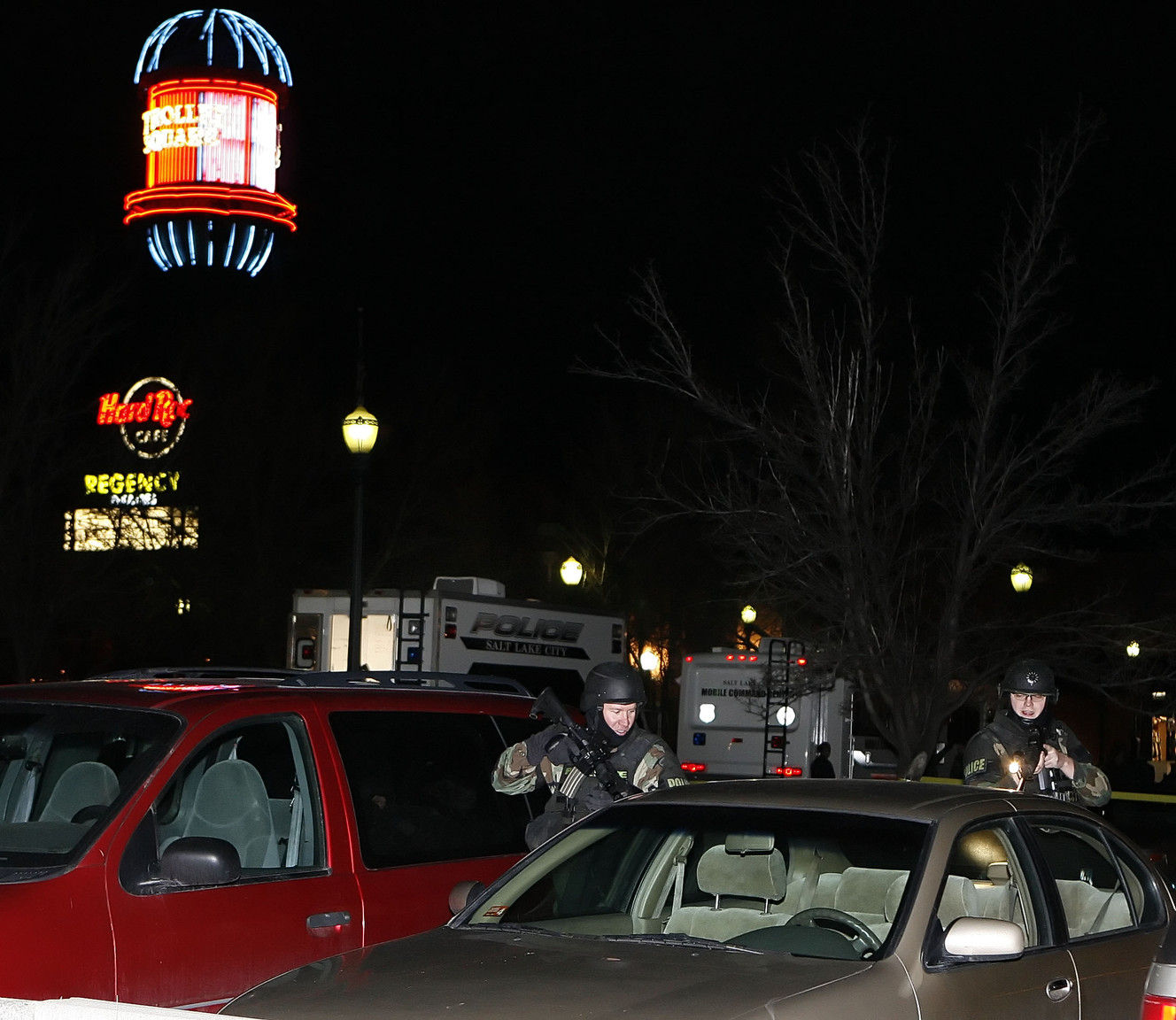 SWAT team members inspect cars in the parking lot outside of the Trolley Square Mall after a gunman opened fire in the Trolley Square shopping mall in Salt Lake City, Utah, Feb. 12, 2007. (Photo: Tom Smart, Deseret News, File)