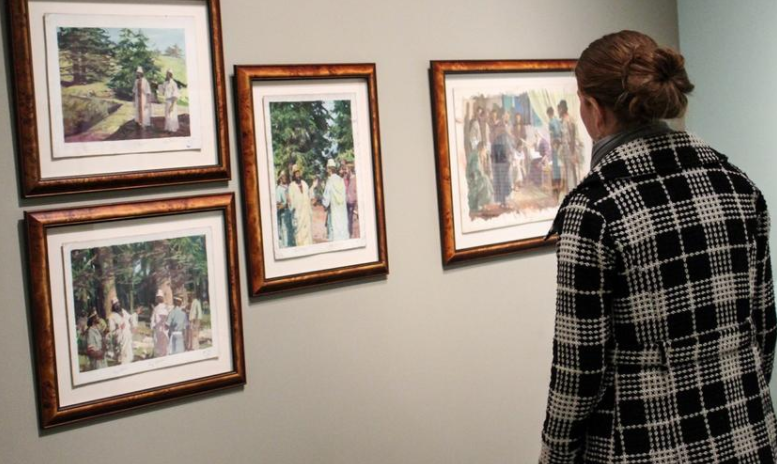 Who is the Seventh-day Adventist whose paintings are all over Mormon churches?