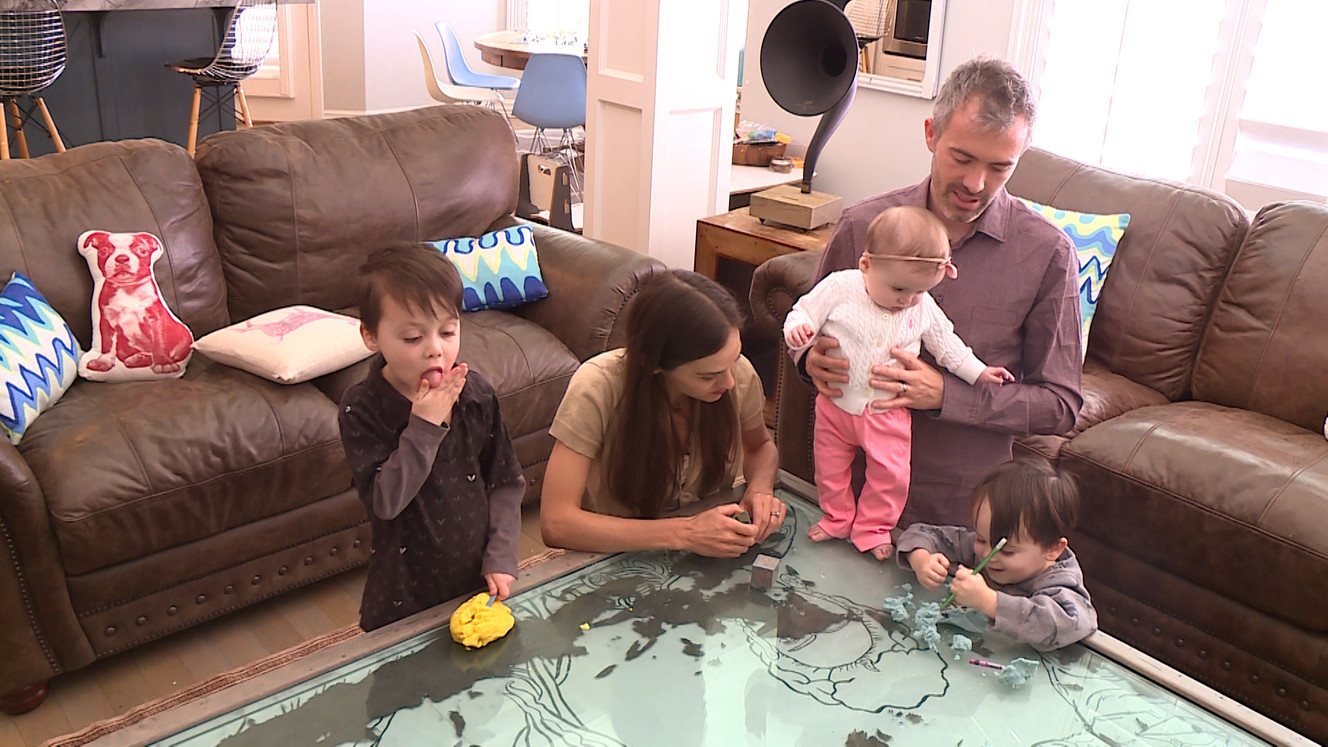 Porter Tillotson takes an opportunity to lick his hands after mashing Play-Doh, while the rest of the family isn't looking. (Photo: Ray Boone, KSL TV)