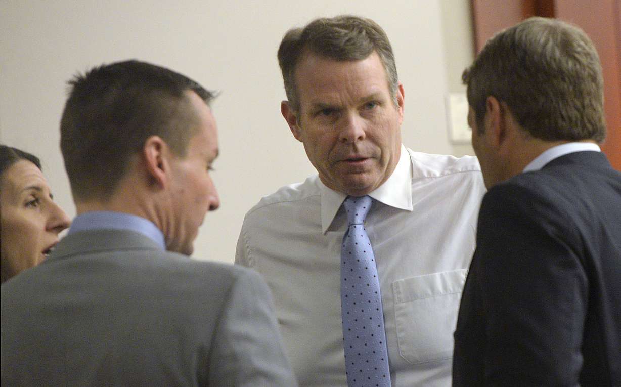 Former Utah Attorney General John Swallow, center, speaks with his defense team — Cara Tangaro, Brad Anderson and Scott Williams — during his trial in Salt Lake City on the Matheson Courthouse on Wednesday, Feb. 15, 2017. (Photo: Al Hartmann)