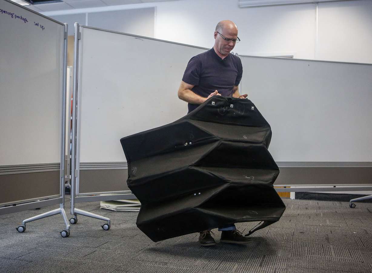 David Morgan, an industrial design professor at BYU, demonstrates how to use the bulletproof origami shield at the Crabtree Engineering Building in Provo on Friday, Feb. 17, 2017. Morgan and other engineers created the shield to protect law enforcement. (Photo: Nicole Boliaux, Deseret News)