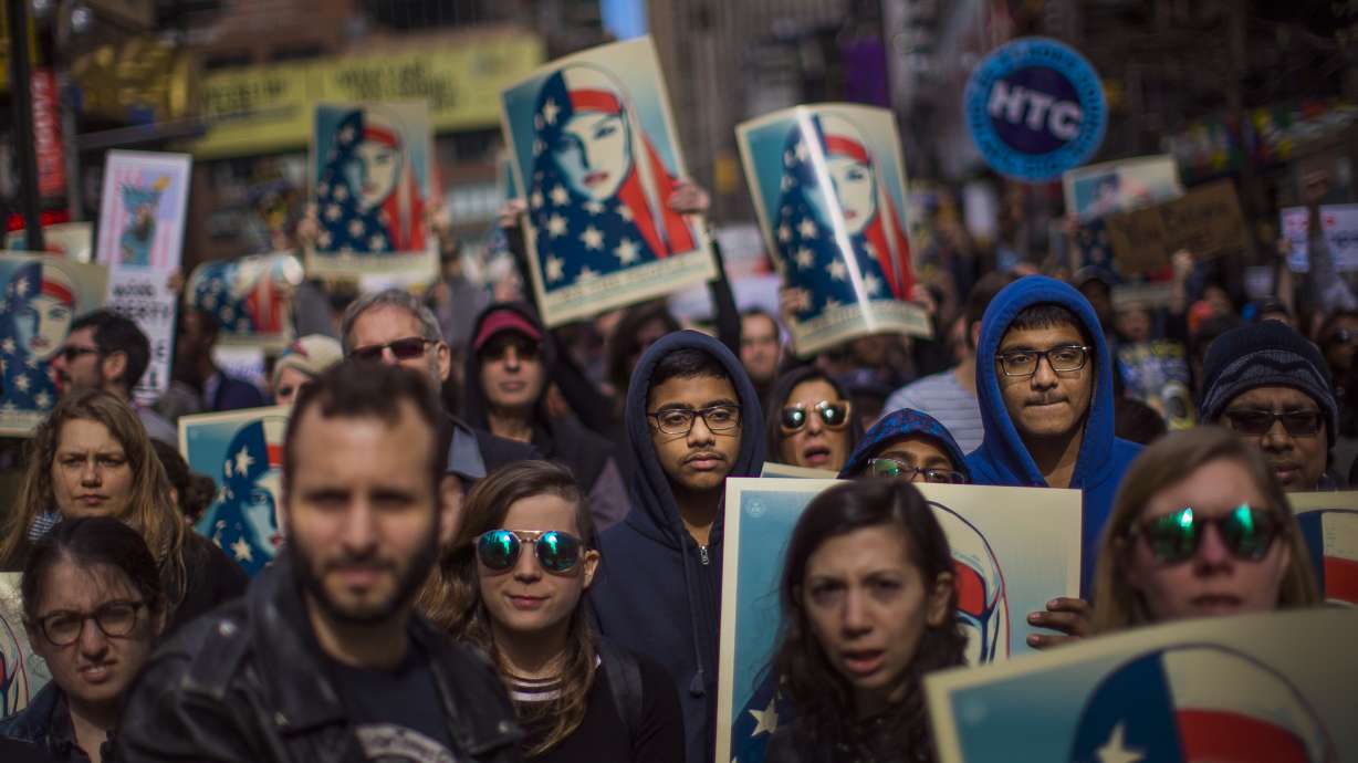 People rally in support of Muslim Americans and protest of President Donald Trump's immigration policies in Times Square on Feb. 19, 2017. A declaration declaring July as Muslim American Heritage Month in Utah recognizes the contributions and hardships of Muslim Americans.
