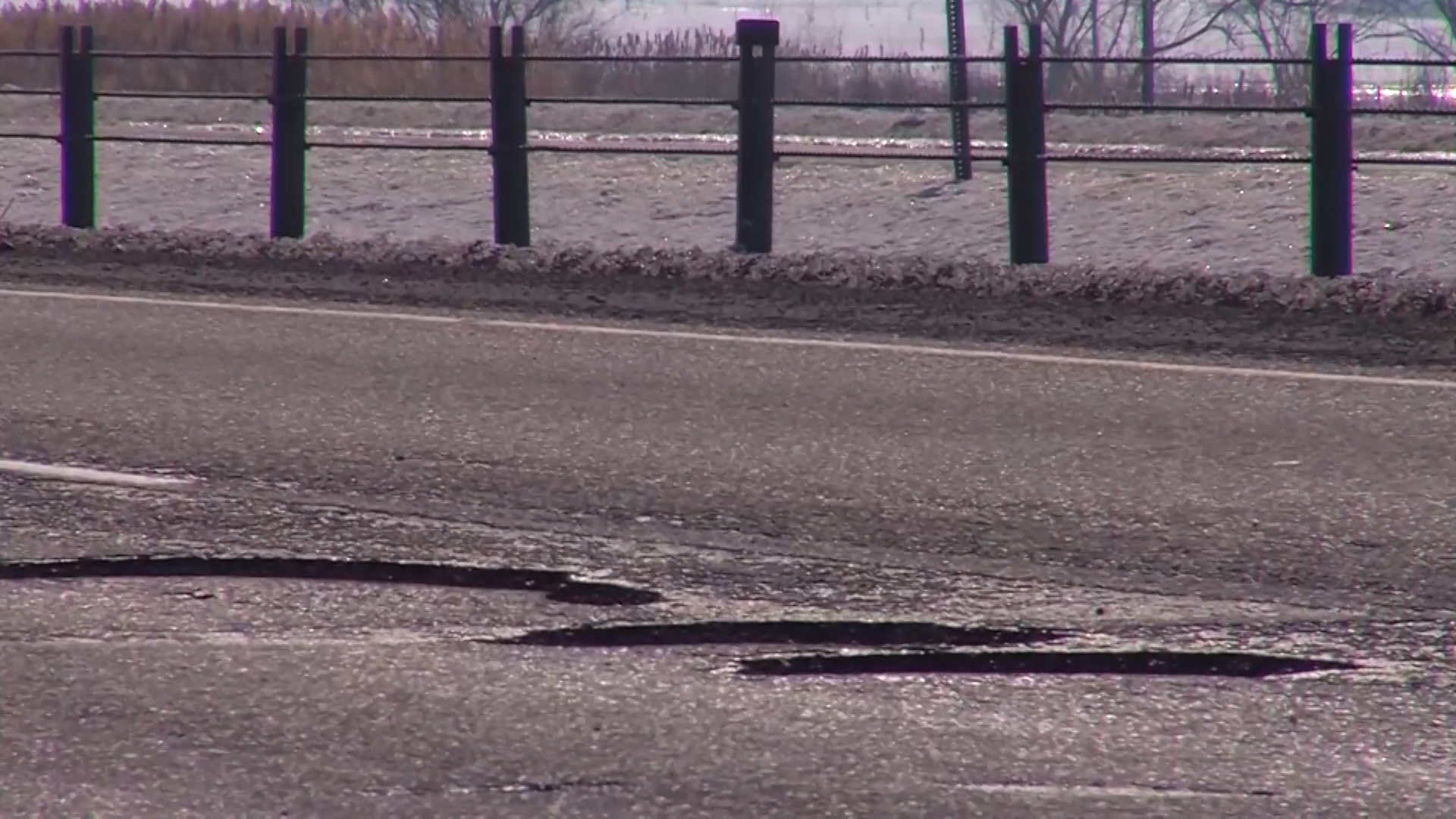 On Redwood Road just north of Bangerter Highway, there's a stretch of potholes in the northbound lane that lasts more than a mile. (Photo: Stuart Johnson, KSL TV)