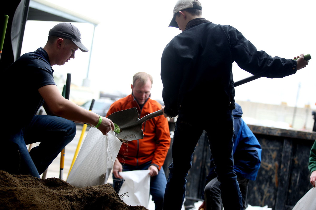 Volunteers and Salt Lake County Mayor Ben McAdams fill sandbags at Salt Lake County Public Works Highway Engineering in Midvale on Wednesday, Feb. 22, 2017. The bags were transported to Box Elder County where flooding has been a problem for days. (Photo: Laura Seitz, Deseret News)