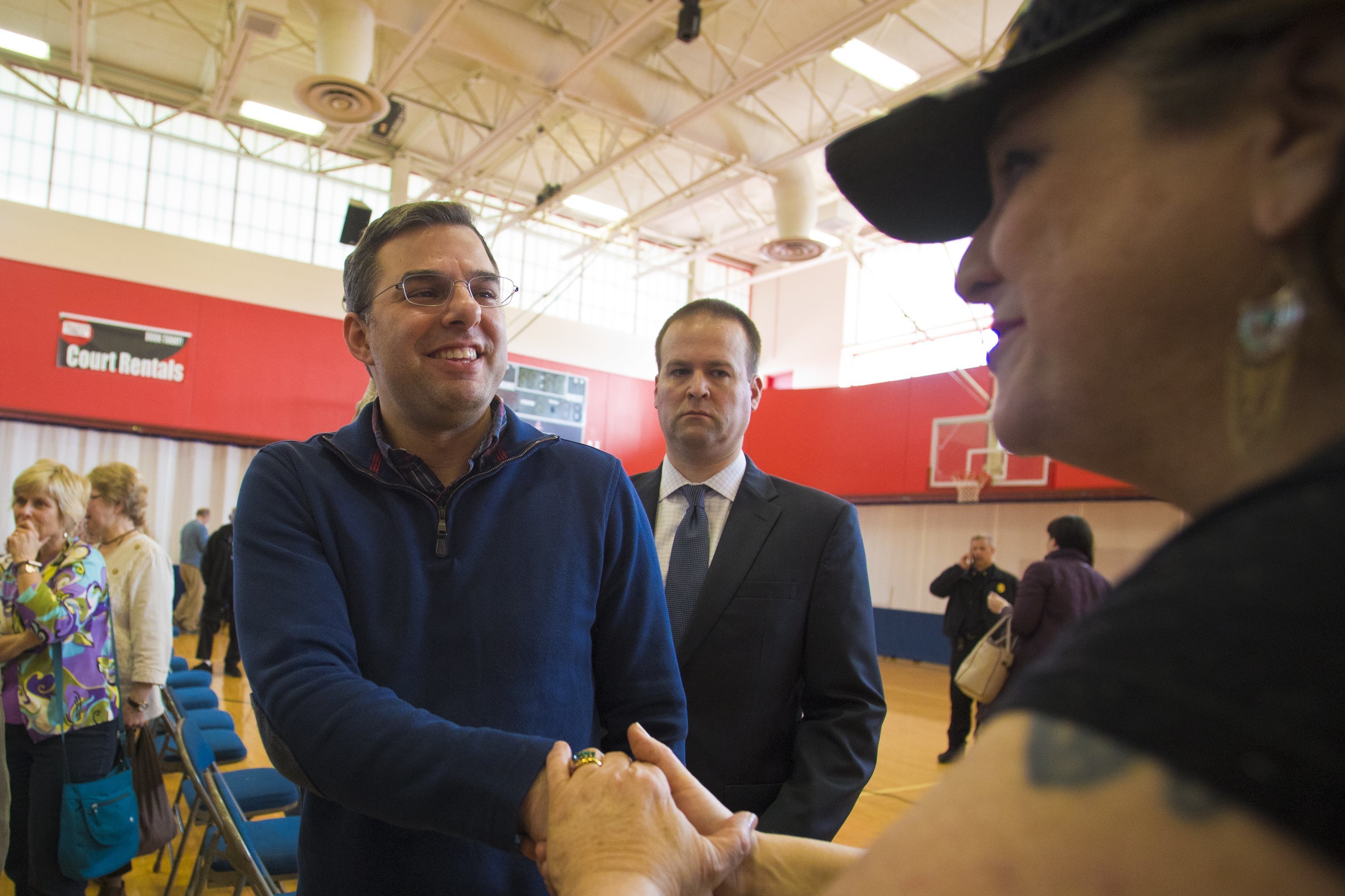 Unlike colleagues, Michigan congressman embraces town halls