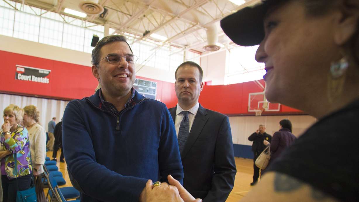 Unlike colleagues, Michigan congressman embraces town halls
