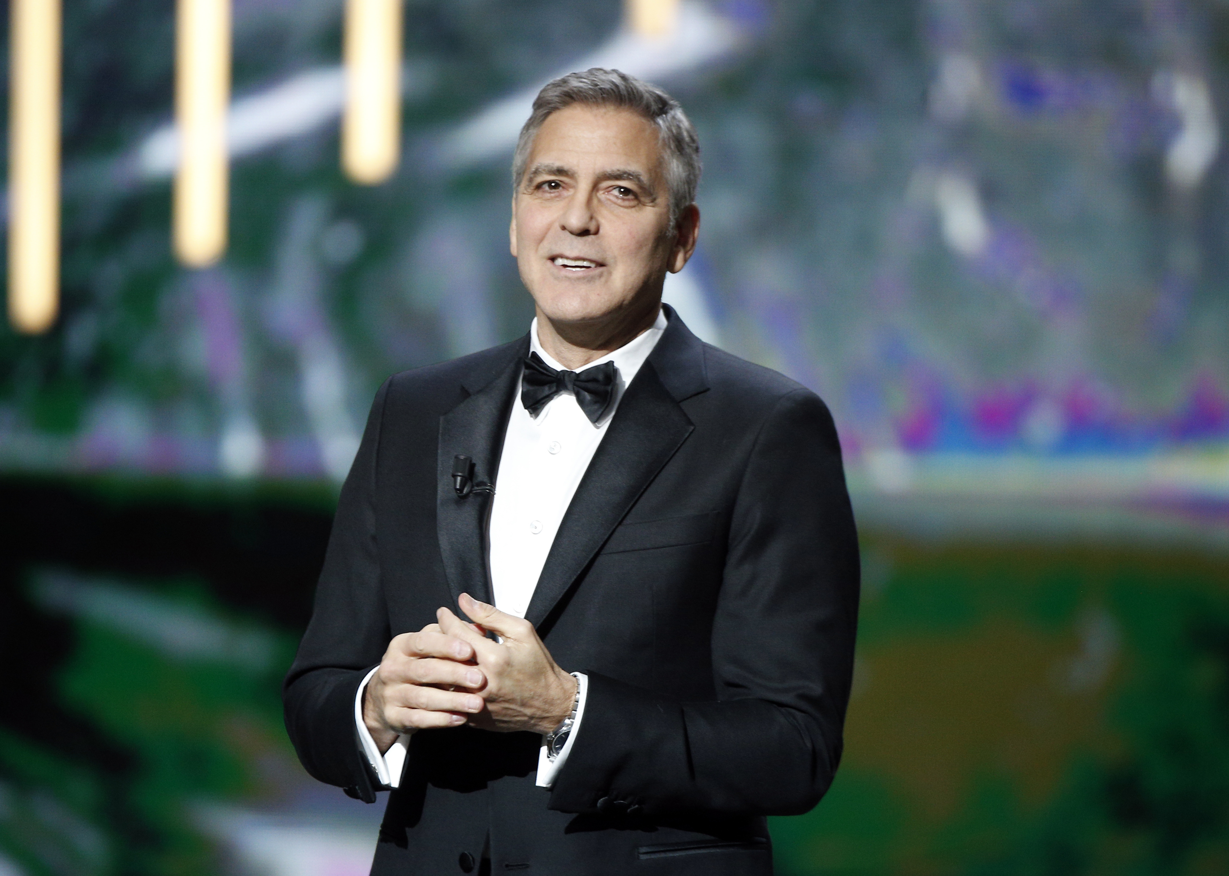 Clooney uses Cesar award to warn about hate in age of Trump