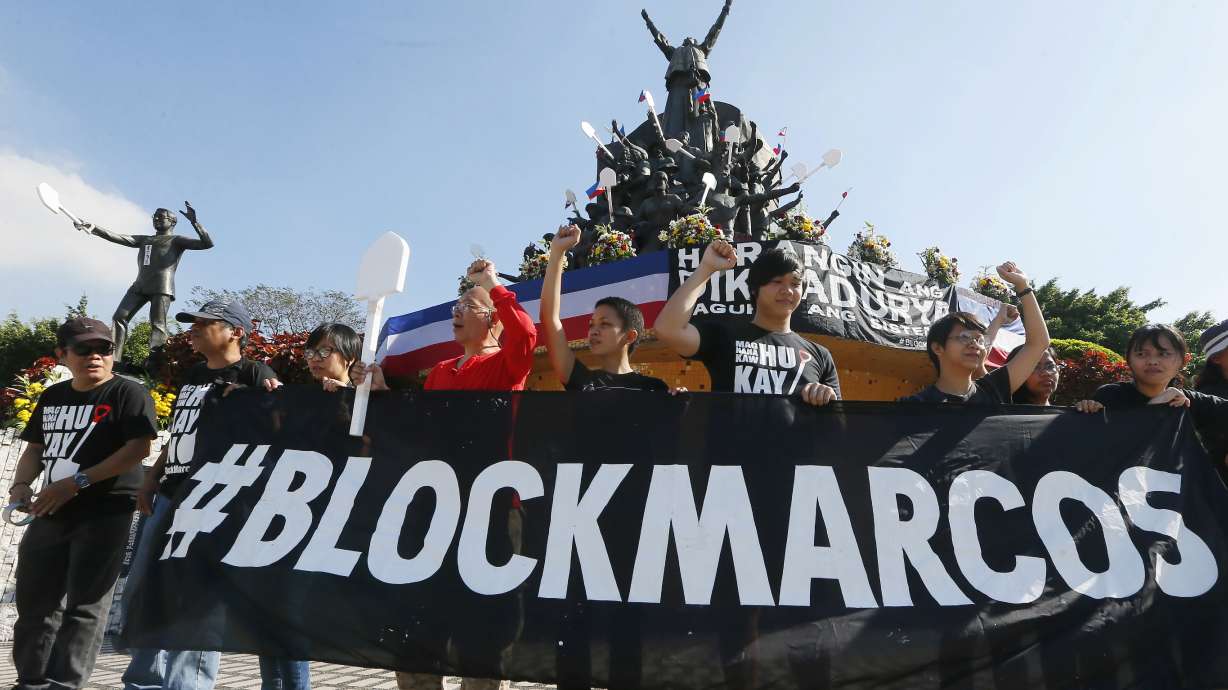 Protesters mark Philippine revolt by condemning killings