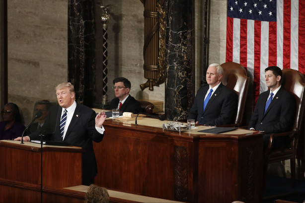 President Donald Trump addresses a joint session of Congress on Capitol Hill in Washington, Tuesday, Feb. 28, 2017. Vice President Mike Pence and House Speaker Paul Ryan of Wis. listen behind. (AP Photo/Alex Brandon)