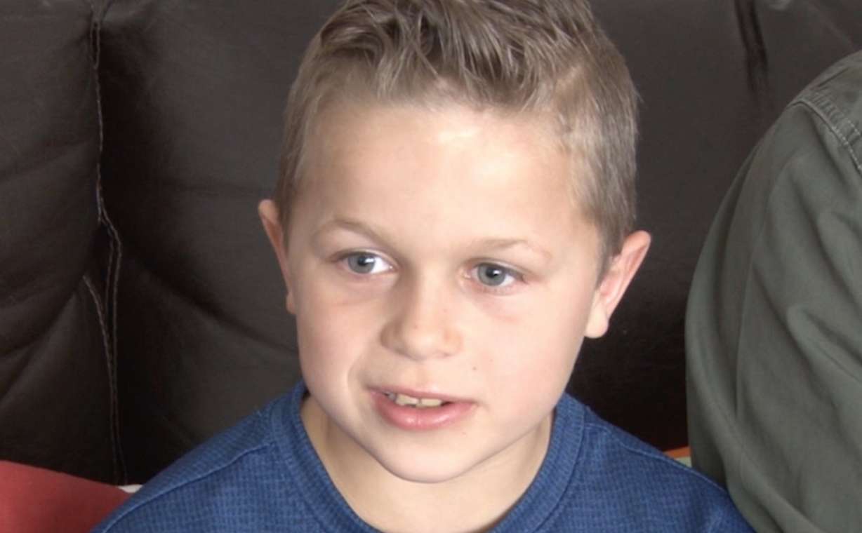 J.T. immediately started to jump on the jack handle and try to lift the car off of his father. (Photo: Nate Eaton, EastIdahoNews.com)