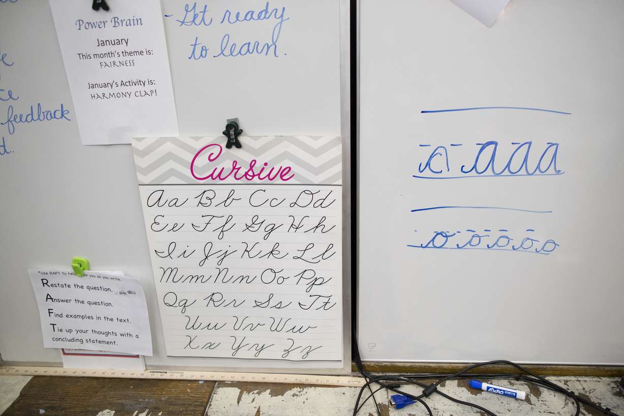 In this Wednesday, March 1, 2017, photo, a sample of cursive letters are on display in the third-grade classroom at P.S. 166 in the Queens borough of New York. Photo: AP Photo