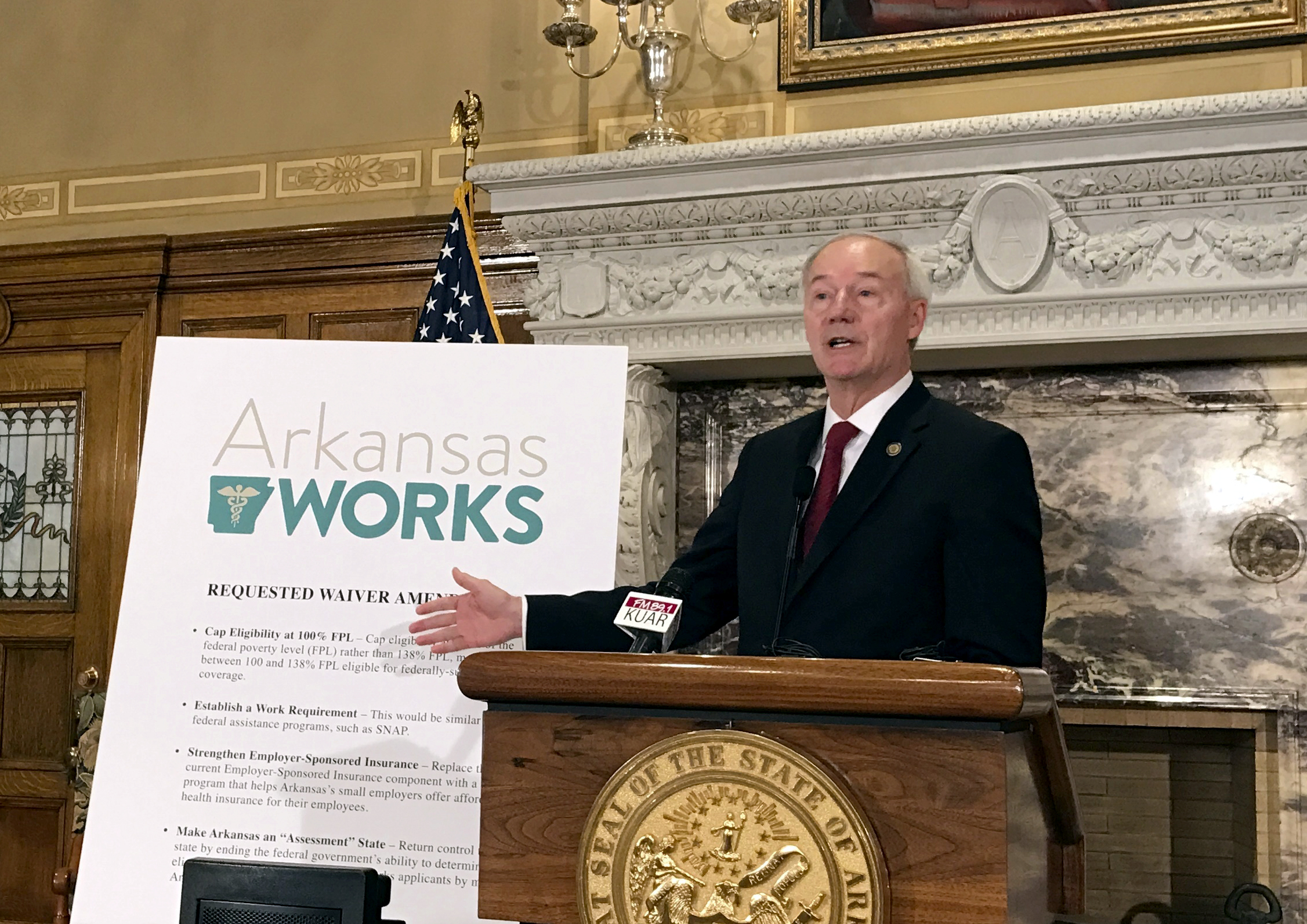 Arkansas governor seeks new restrictions on Medicaid plan