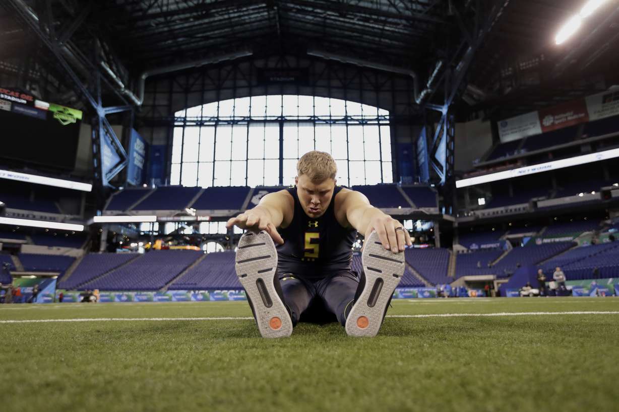 Utah offensive lineman Garett Bolles stretches at the NFL football scouting combine Friday, March 3, 2017, in Indianapolis. (AP Photo/David J. Phillip)