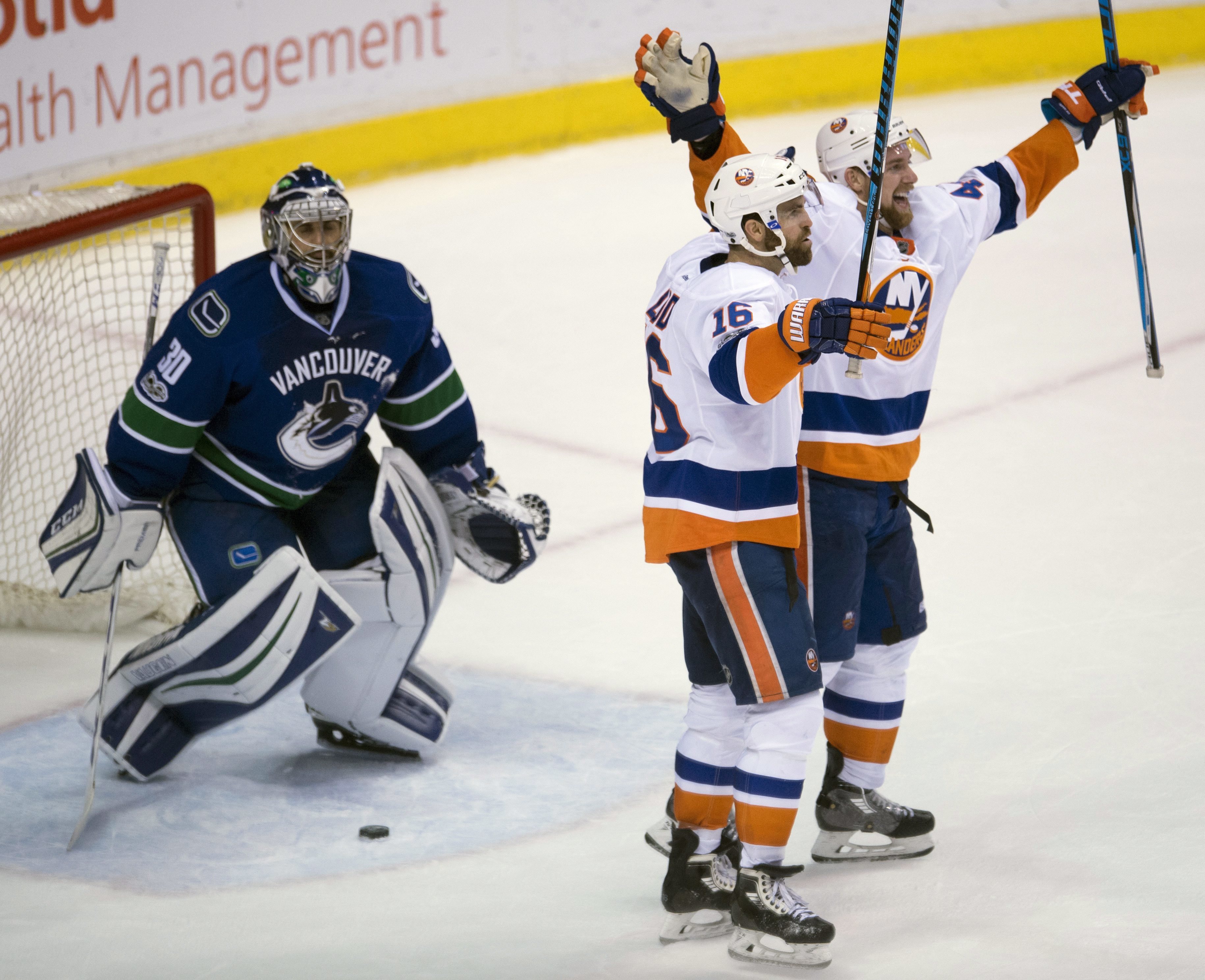 Ladd scores in OT and Islanders top Canucks 4-3