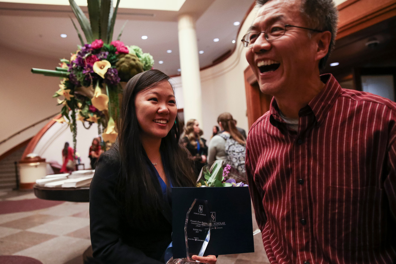 Kathy Liu and her father, John Liu, celebrate after the Sterling Scholar Awards Ceremony at the LDS Conference Center in Salt Lake City on Thursday, March 9, 2017. Photo: Spenser Heaps, Deseret News