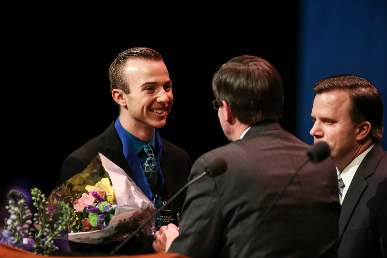 Johnathan Tanner is presented with the Zions Bank Community Service Award. Photo: Spenser Heaps, Deseret News