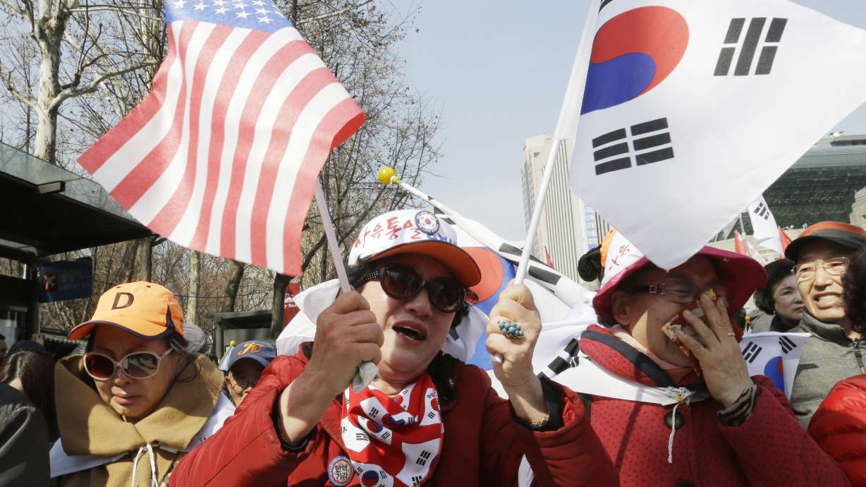 S.Koreans celebrate Park's removal, but ousted leader silent