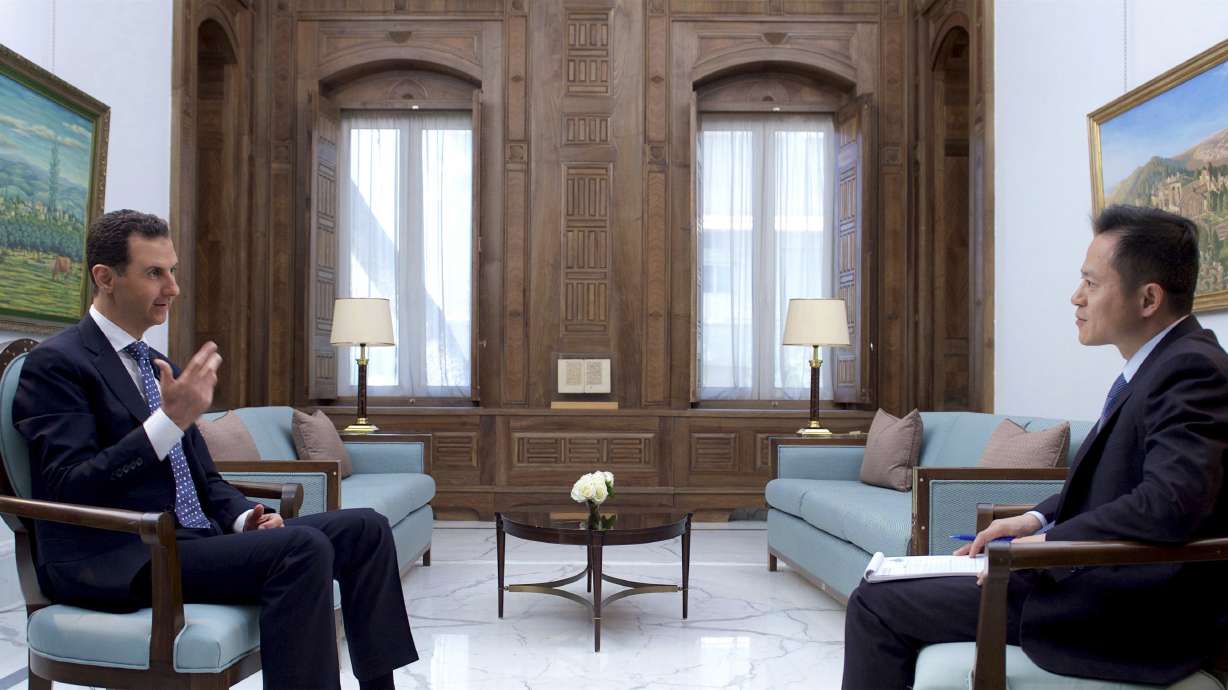 The Latest: Iraq FM: 40 Iraqis killed in Damascus blasts