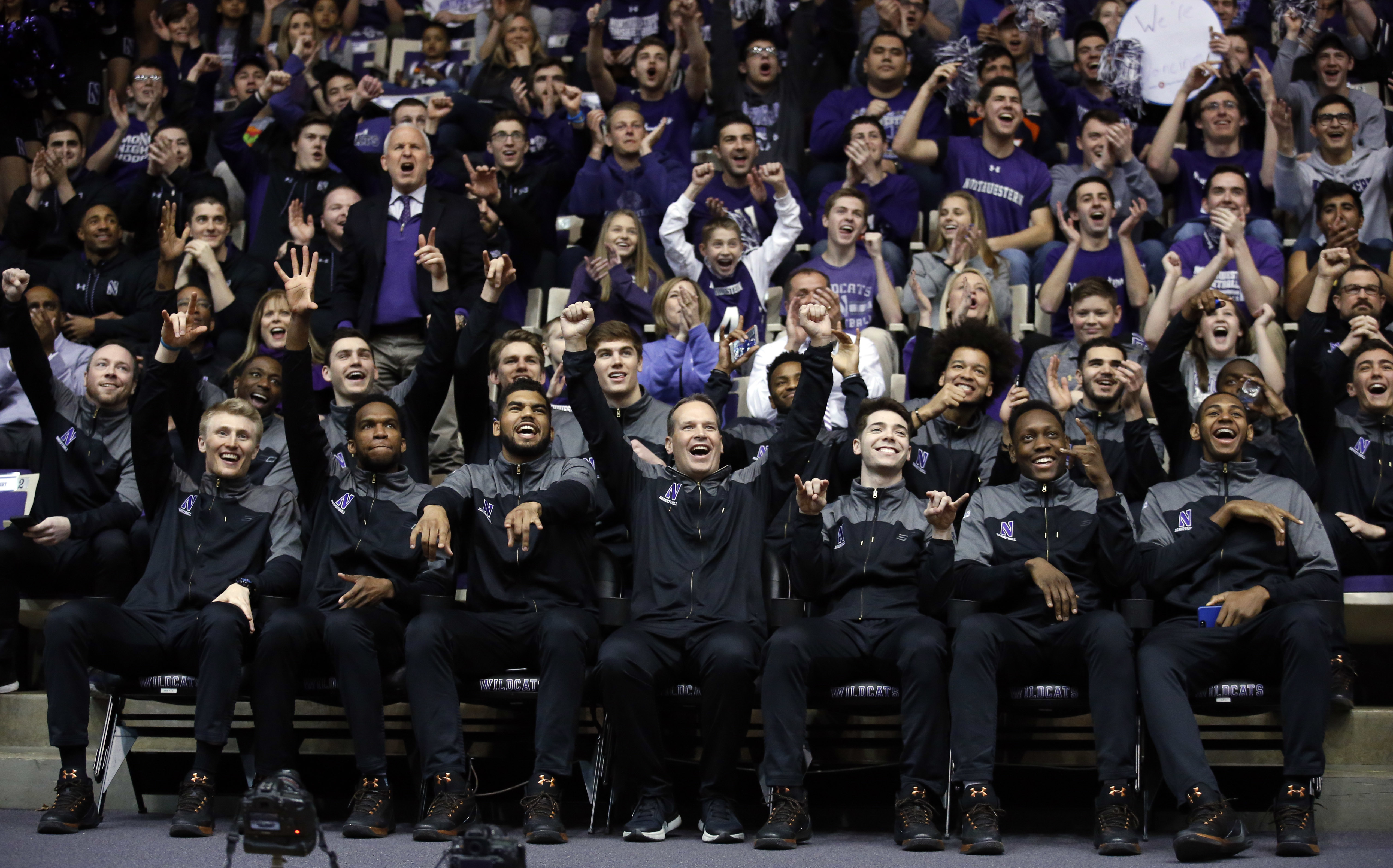 Northwestern head coach Chris Collins, center, and players react during a NCAA Division I Men's Basketball Tournament Selection Show watch party, Sunday, March 12, 2017 at Welsh-Ryan Arena in Evanston, Illinois. This is the first time that Northwestern Men's Basketball team has been selected to play in the NCAA Tournament. Northwestern will play against Vanderbilt in the first round. (Nam Y. Huh, AP Photo)