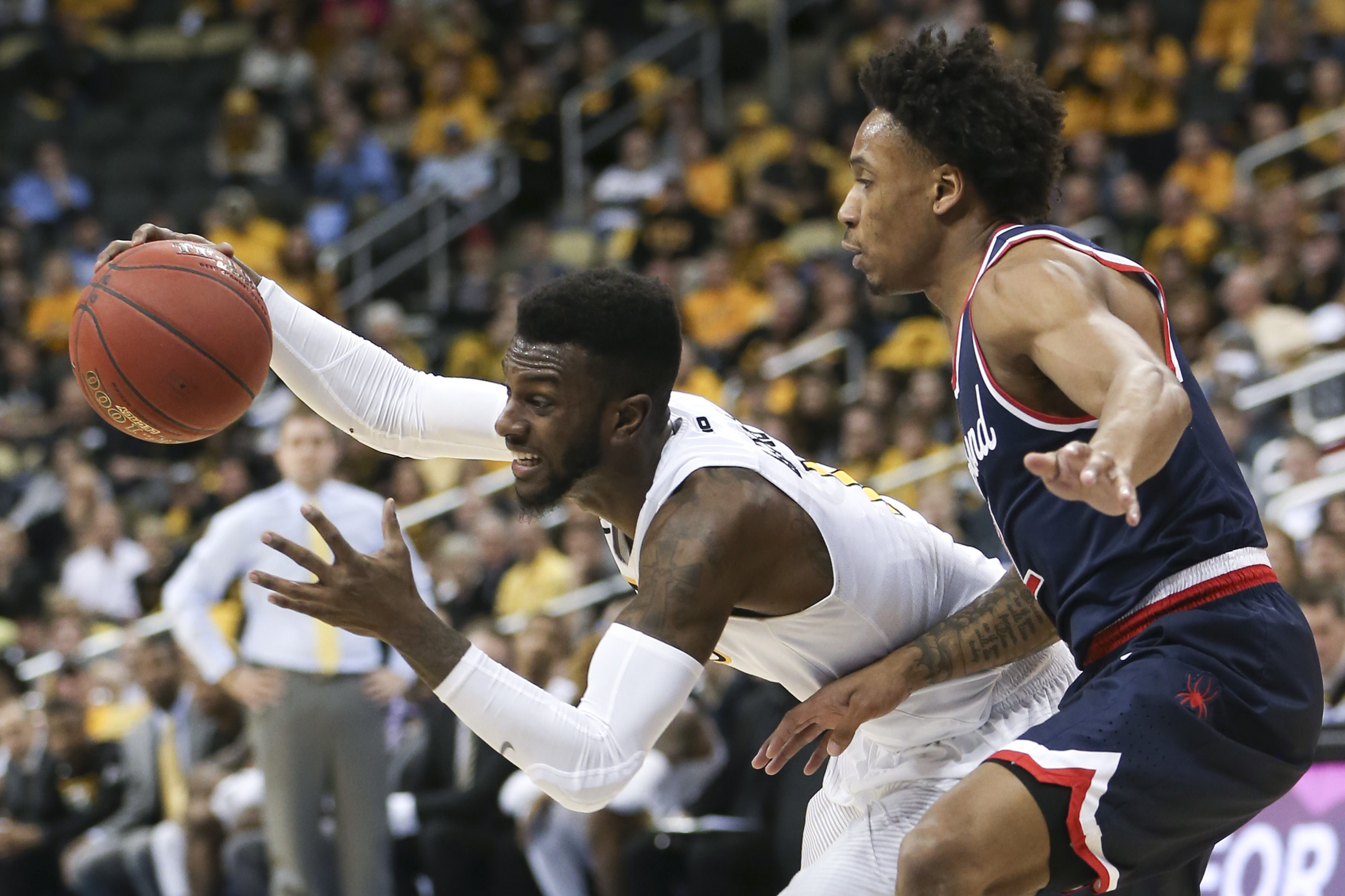 VCU's JeQuan Lewis, left, controls the ball as Richmond's Julius Johnson defends during the first half of an NCAA college basketball game in the Atlantic 10 tournament semifinals Saturday, March 11, 2017, in Pittsburgh. (Keith Srakocic, AP Photo, File)