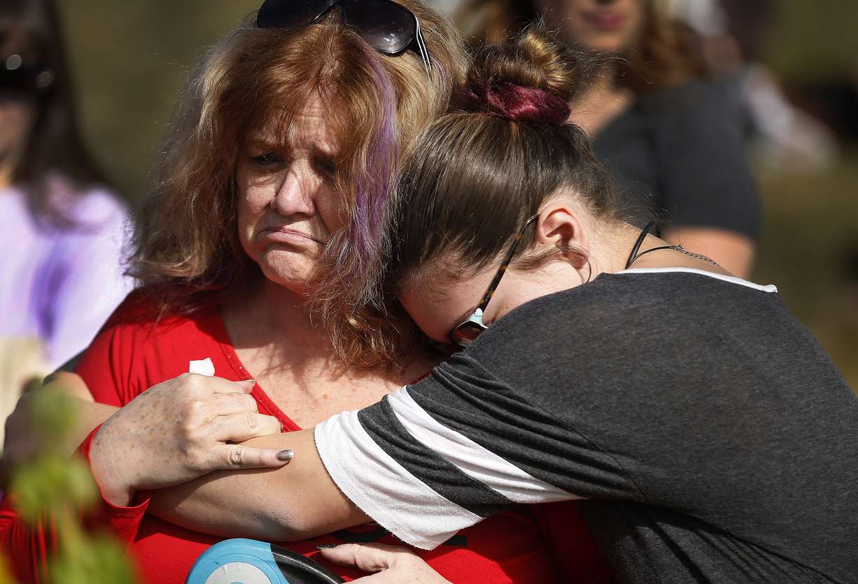 Debbie Calton and Brooklyn Llewelyn hug during the Humane Society of Northern Utah's organized vigil for Sage at Kiwanis Park in Clearfield on Sunday, March 12, 2017. Sage is a cat who was tortured and died and a reward of nearly $50,000 has been offered for information leading to the arrest and conviction of those responsible. (Photo: Jeffrey D. Allred, Deseret News)