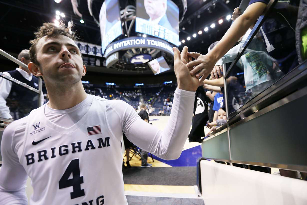 BYU guard Nick Emery (4) gives high fives to fans after the game as BYU falls to the University of Texas at Arlington play in NIT basketball action at the Marriott Center in Provo Utah on Wednesday, March 15, 2017. (Photo: Scott G Winterton, Deseret News)