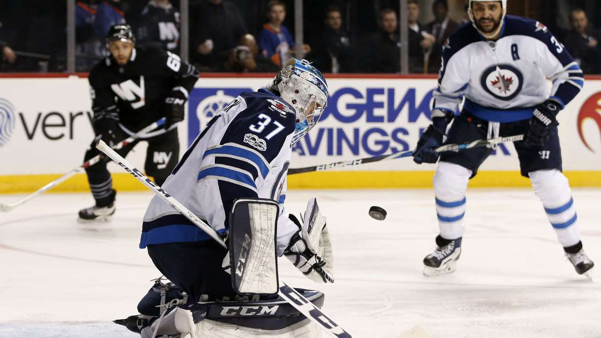 Little scores twice, Hellebuyck solid as Jets beat Isles 4-2