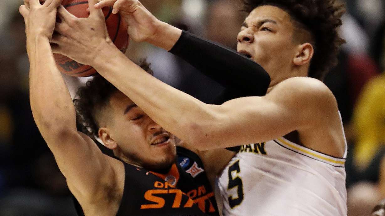 Michigan delivers 3-point punch to knock out Oklahoma St.