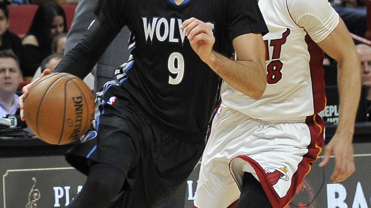 Heat pull away late, top Timberwolves 123-105