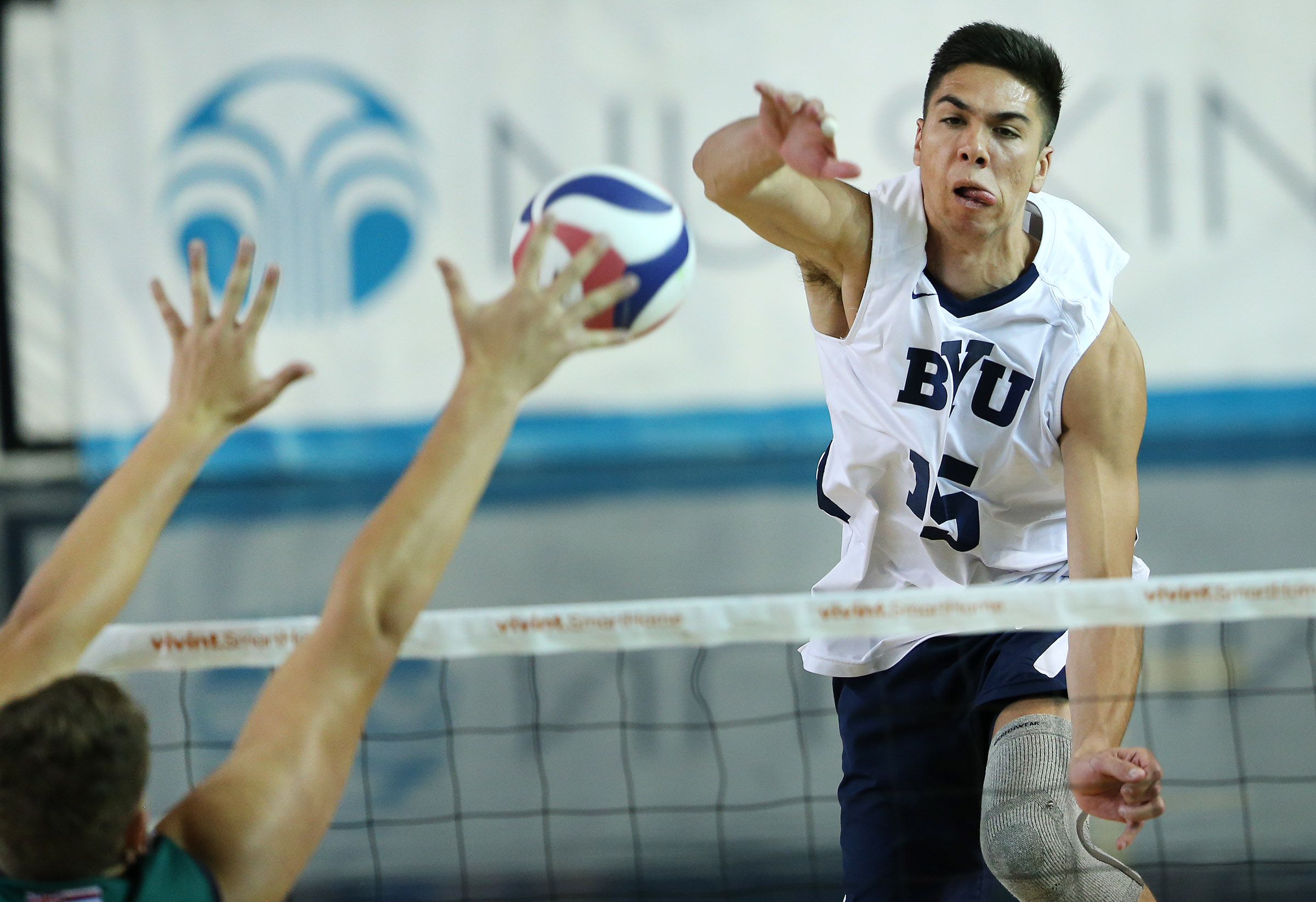 BYU's Brenden Sander spikes the ball during volleyball action against Hawaii at the Smith Field House in Provo, BYU won in straight sets 3-0 on Friday, March 17, 2017.