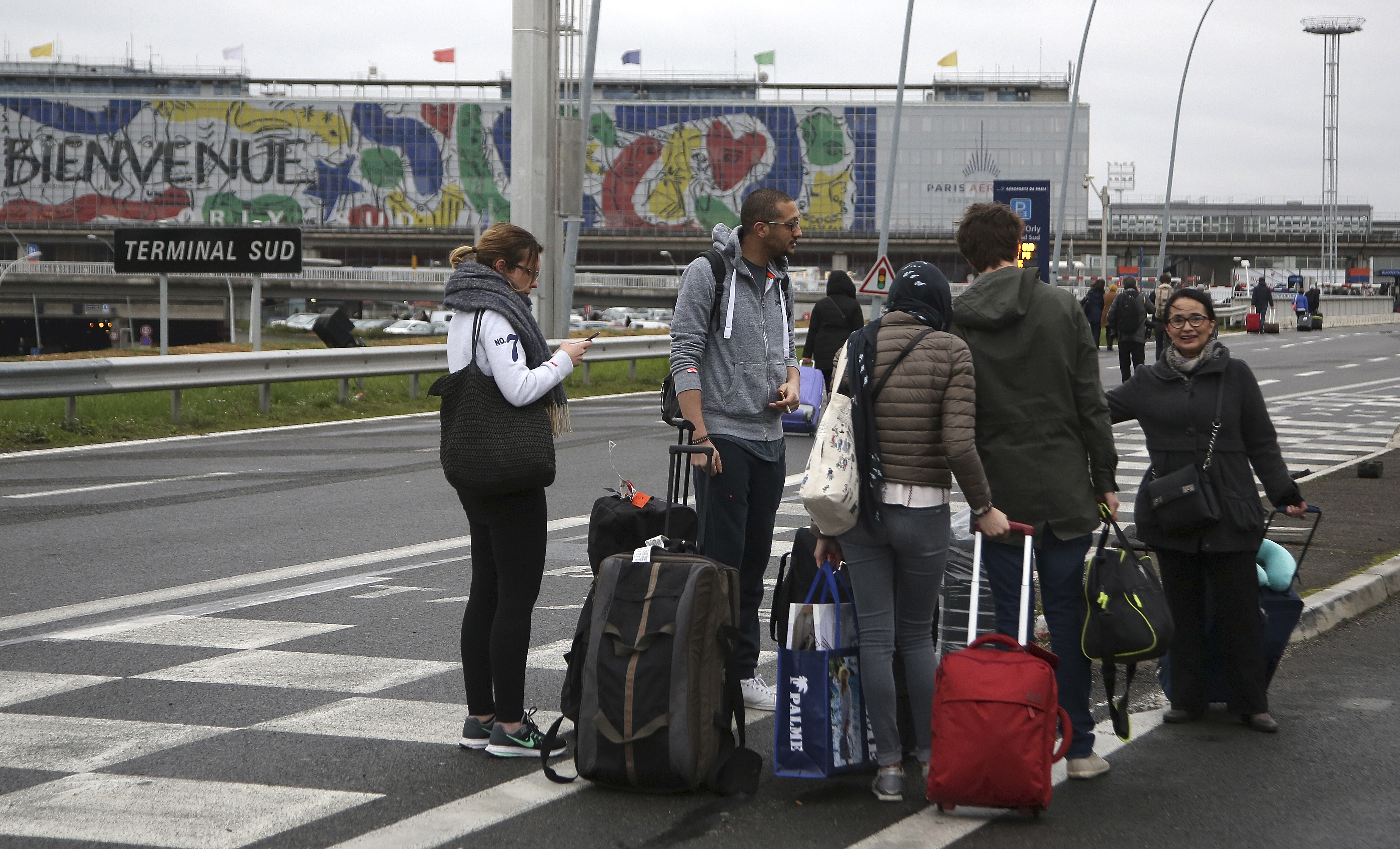 The Latest: Orly attacker used revolver to detain soldier