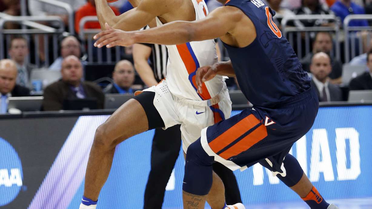 Leon, Robinson shine, Florida routs Virginia 65-39 in NCAAs