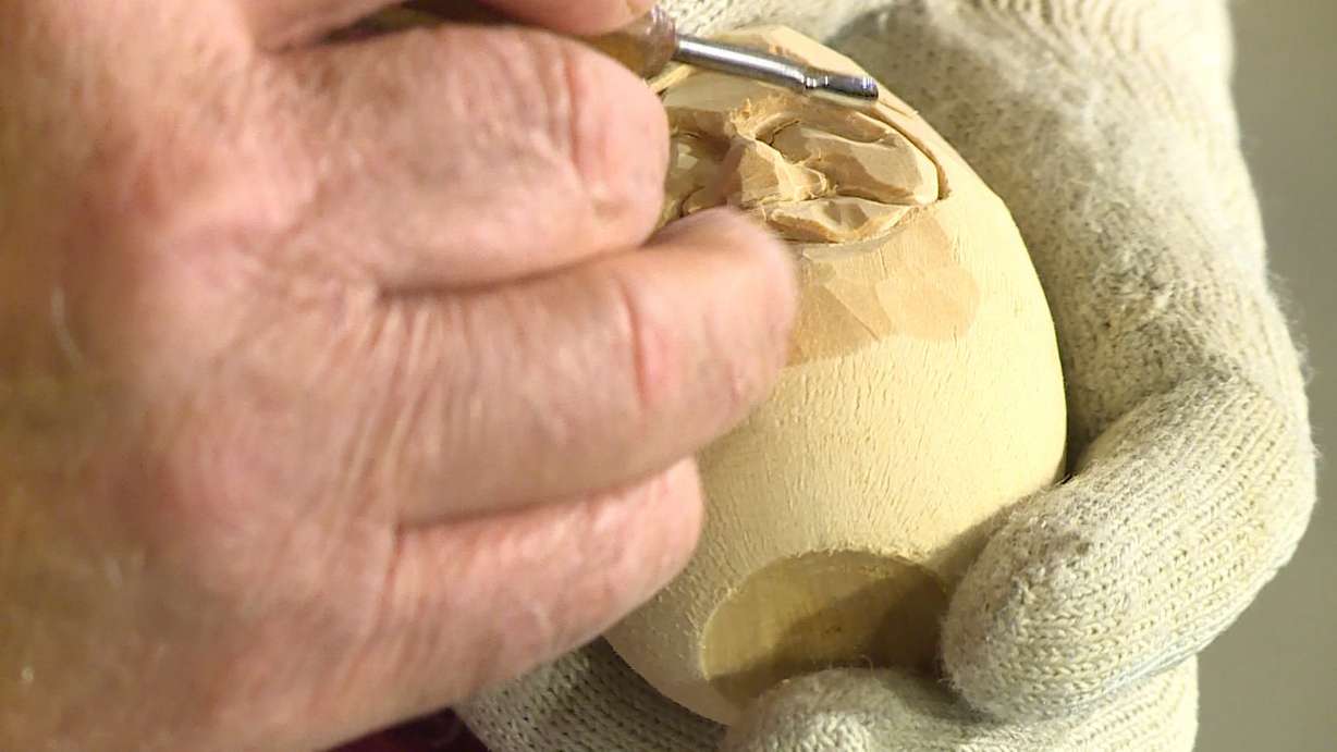 Jon Nelson works on a "Santa egg." (Photo: Ray Boone, KSL TV)