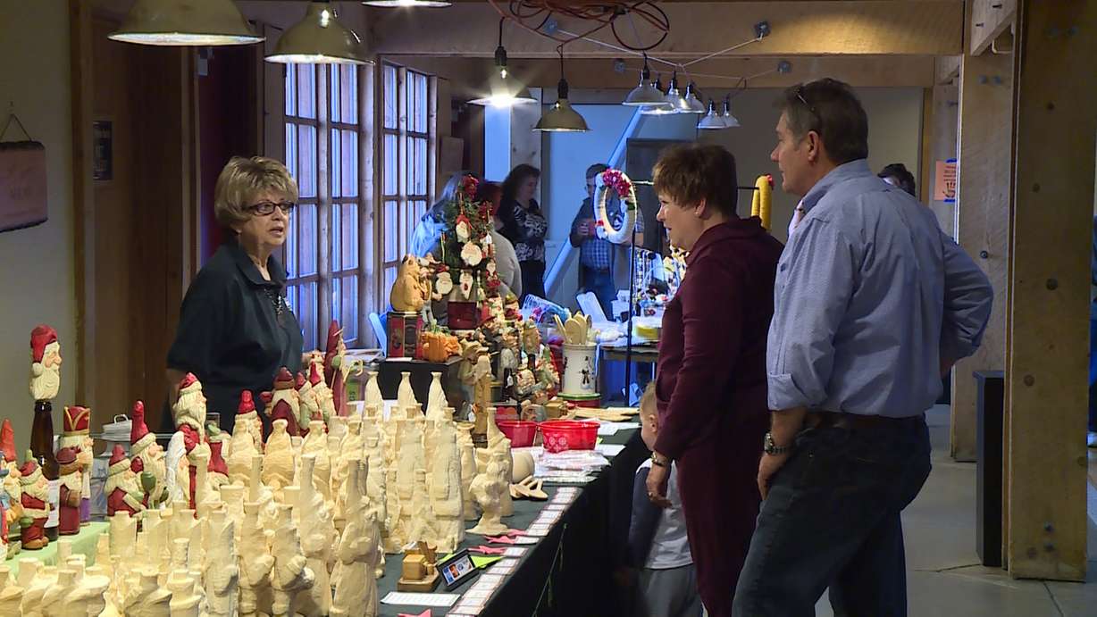 Donna Nelson explains to customers how their "roughouts" can help newcomers get started. (Photo: Ray Boone, KSL TV)