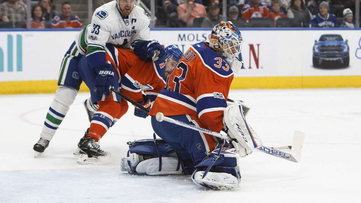 Talbot makes 33 saves, Oilers blank Canucks 2-0