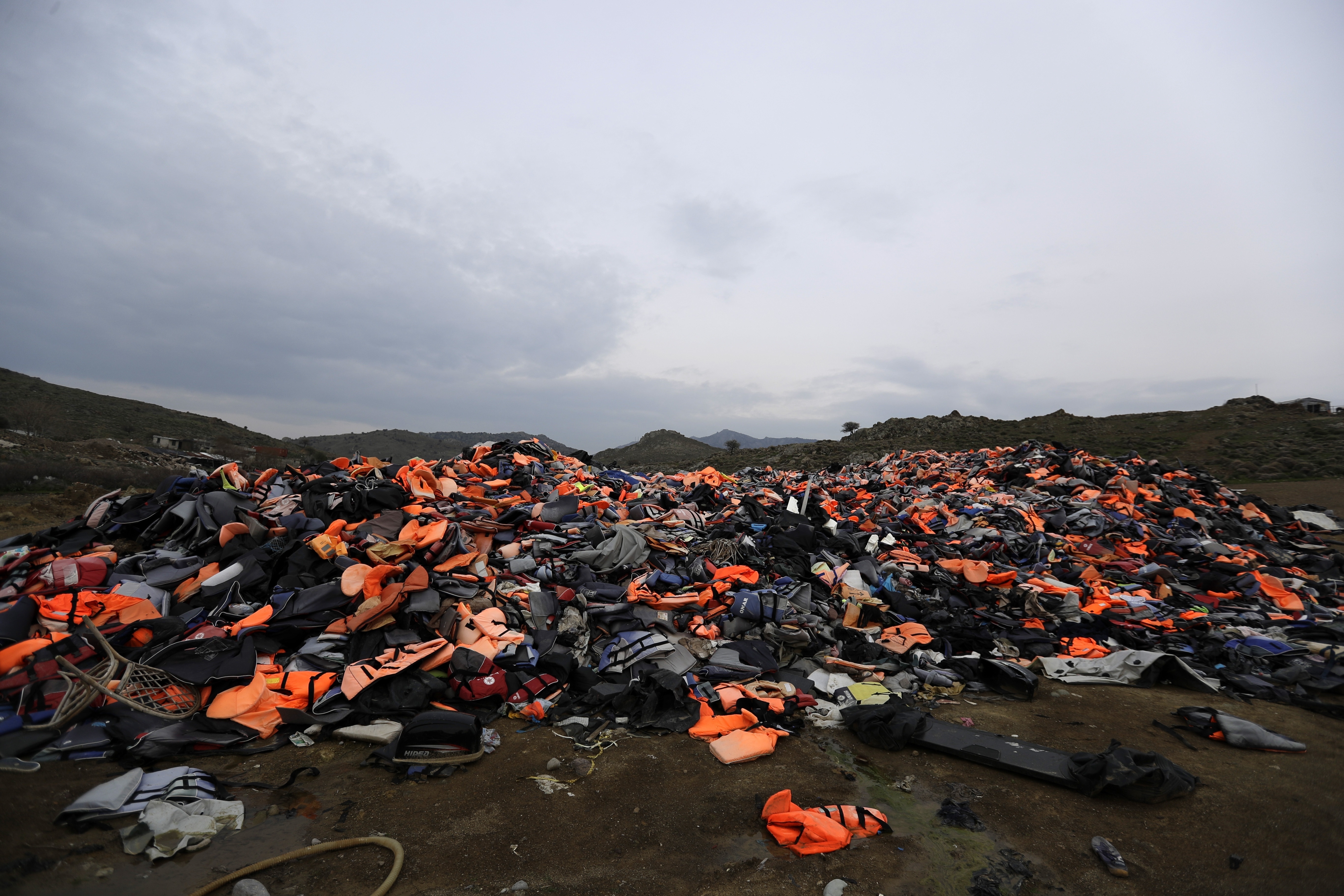 The Latest: EU praises year-old migrant deal with Turkey