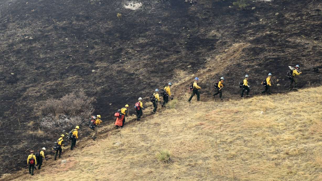 The Latest: Colorado wildfire fully contained
