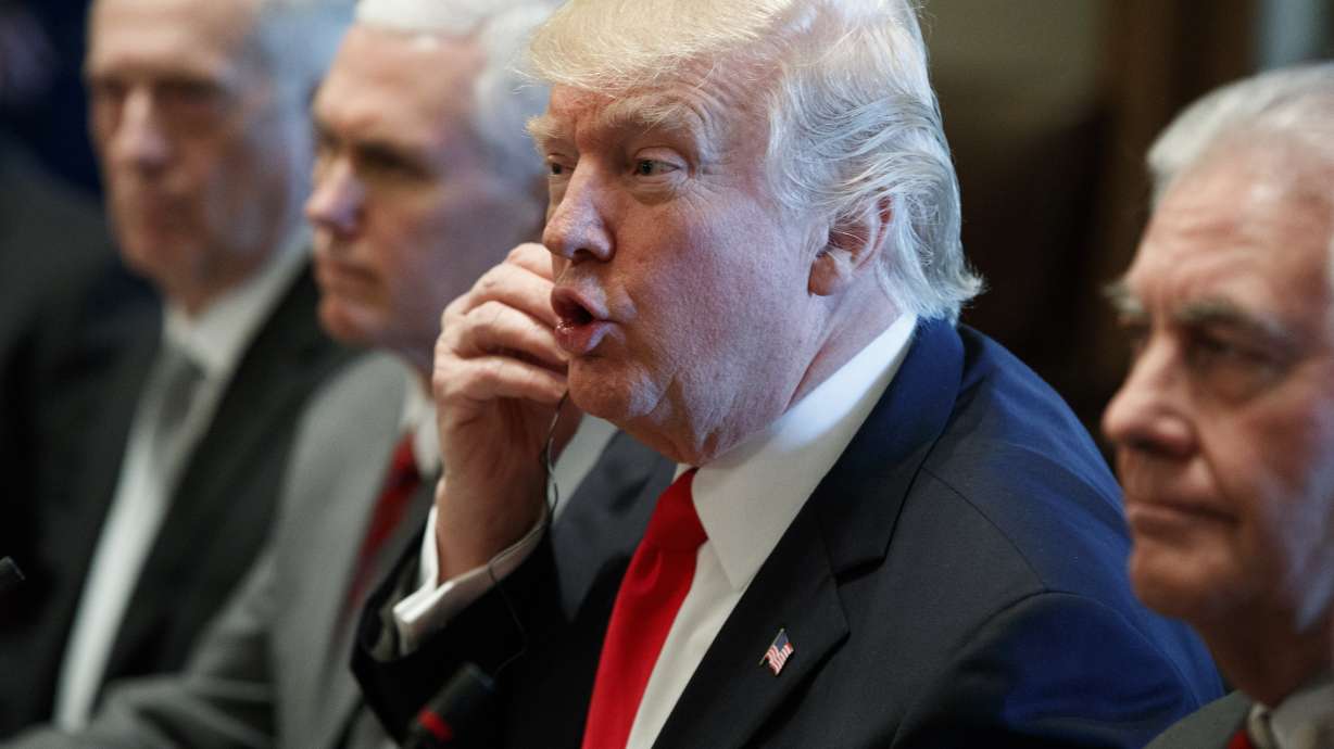 The Latest: Meeting with Iraqis, Trump criticizes Iran deal