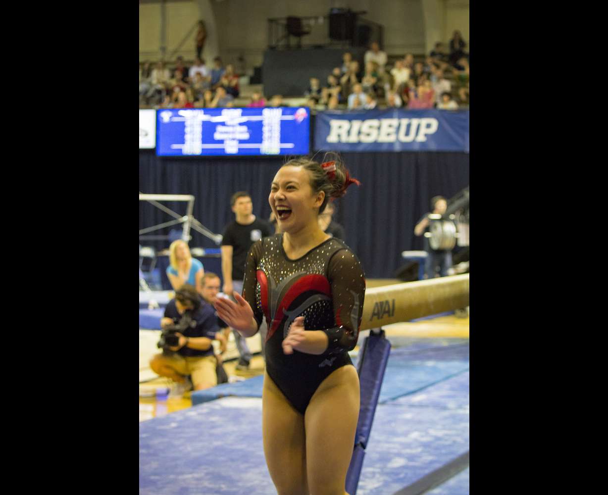 SUU senior gymnast Stacie Webb celebrates after sticking the landing on her balance beam routine during a meet at BYU on March 13, 2017. Judges gave Webb a perfect 10 for the routine — the first in SUU's history. (Photo: Carter Williams, KSL.com)