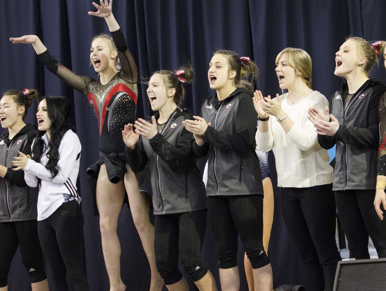 SUU gymnasts cheer on a teammate during a routine during a meet at BYU on March 13, 2017. (Photo: Carter Williams, KSL.com)