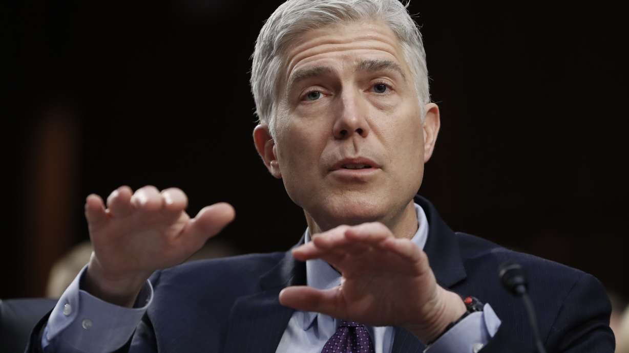 The Latest: Gorsuch flatters senators as questioning wraps